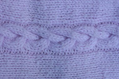 Örgü desenli yün kumaştan yapılmış kumaşın eflatun rengi.