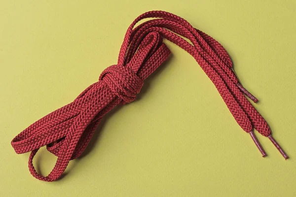 One Skein Red Laces Lies Yellow Table — Stock Photo, Image