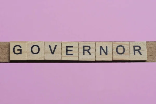 Word Governor Small Gray Wooden Letters Lies Pink Background — Stock Photo, Image
