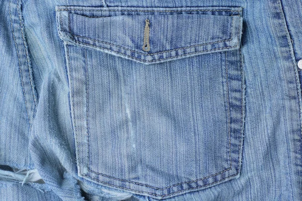 グレーブルーのコットン生地の質感と古いジーンズポケット — ストック写真