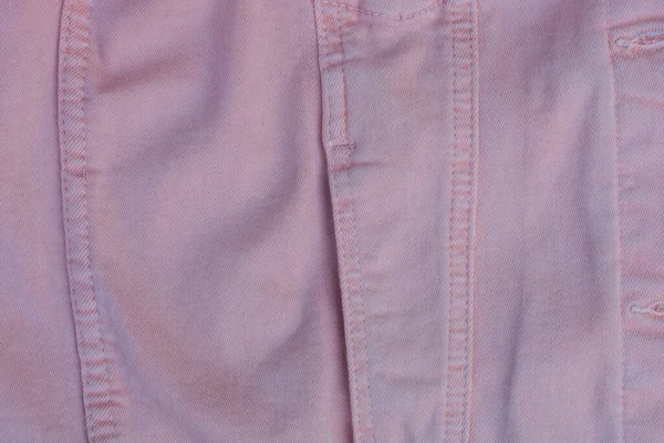 粉色棉织物的质地 有口袋 衣服上有缝合线 — 图库照片