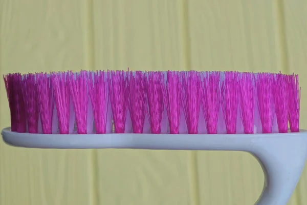 One White Plastic Brush Purple Bristles Yellow Background — Stock Photo, Image