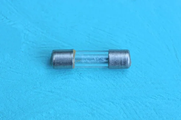 One Small Electric Gray Glass Metal Fuse Lies Lies Blue — Stock Photo, Image