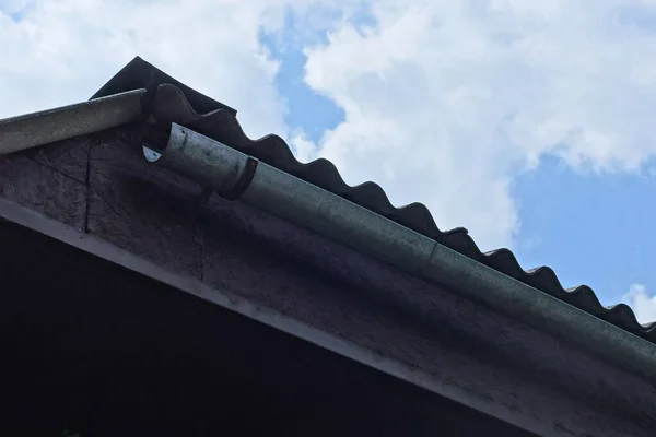 Gray Metal Drainpipe Brown Attic Board Roof Outdoors Blue Sky — Stock Photo, Image