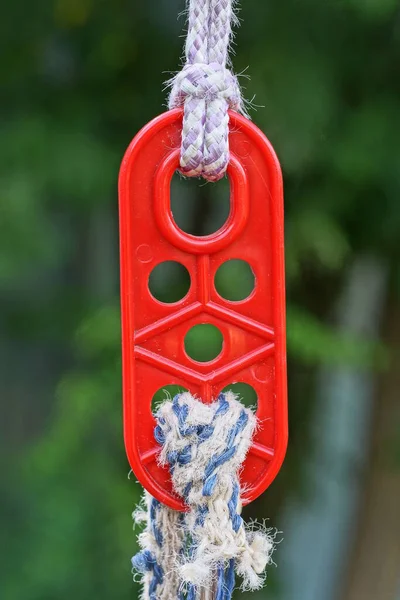 One Red Plastic Carabiner Clasp Hanging White Rope Street — Stock Photo, Image