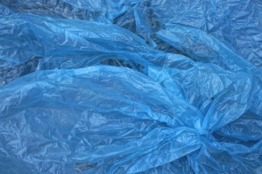 Selofan buruşuk parçasının mavi plastik doku