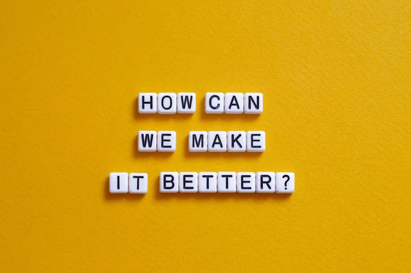 How can we make it better - word concept on cubes, text, letters