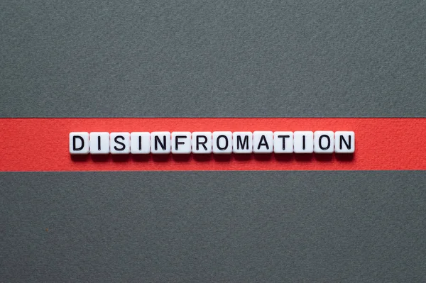 stock image Disinformation - word concept on cubes, text, letters