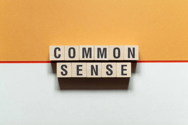 Common sense - word concept on cubes, text, letters