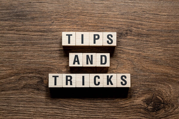 Tips and tricks - word concept on building blocks, text, letters