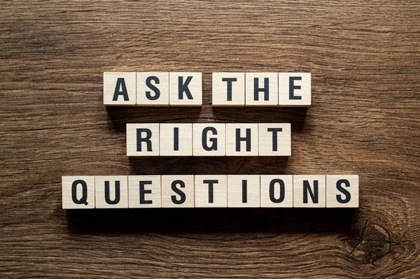 Ask the right questions - word concept on building blocks, text, letters