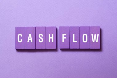 Cash flow - word concept on building blocks, text, letters clipart