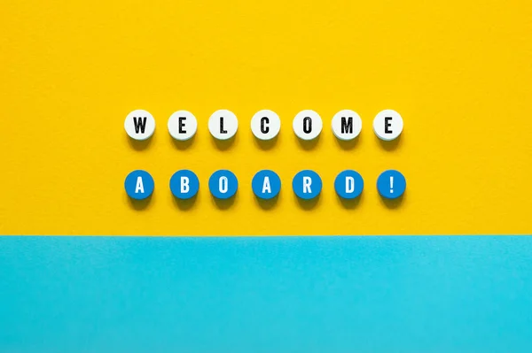 Welcome aboard - word concept on building blocks, text, letters