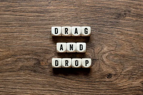 Drag and Drop - word concept on building blocks, text, letters