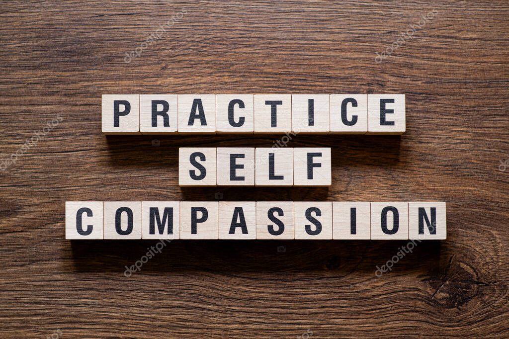 Practice self compassion - word concept on building blocks, text, letters