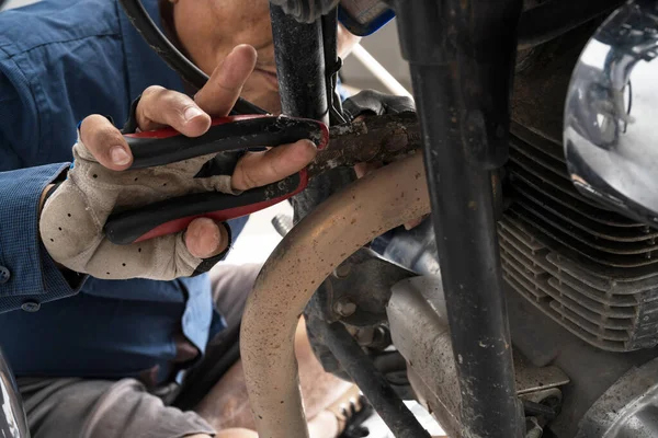 Stock image Motorbike Mechanic, People are repairing a motorcycle Use a wrench and a screwdriver to work