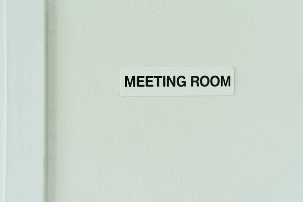 Sign of meeting room on the wall in modern office