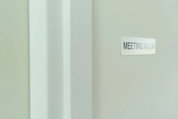 Sign of meeting room on the wall in modern office