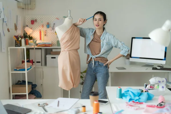 Female entrepreneurs are making new clothing collections from her design with a modern.