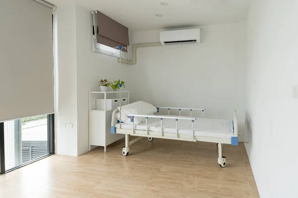 Recovery Room with beds on interior of an empty hospital room that is well ventilated