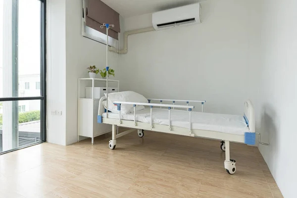 Recovery Room with beds on interior of an empty hospital room that is well ventilated