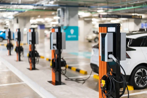 Charging of electric cars at a charging station, automotive industry, transportation, modern technology
