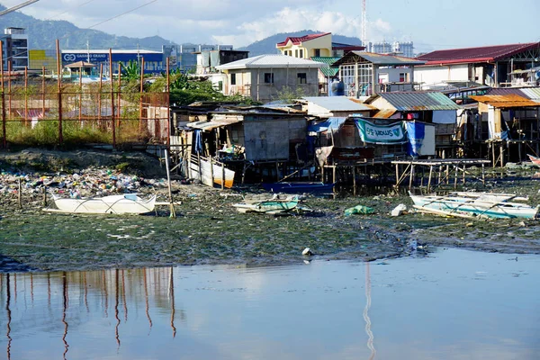 stock image Cebu, philippines, circa February 2023 - poor man squatter near a river