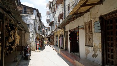 narrow alley in stone town on zanzibar island clipart