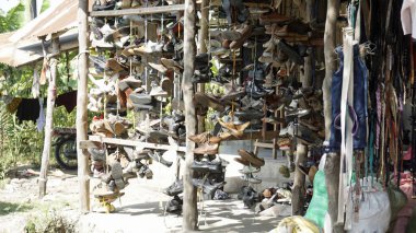 Stonewown, Zanzibar - October 2024: Second hand clothes sold on a local market clipart