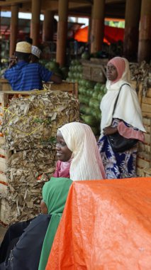 Stonetown, Zanzibar - October 2024: Residents at the local fresh market  clipart