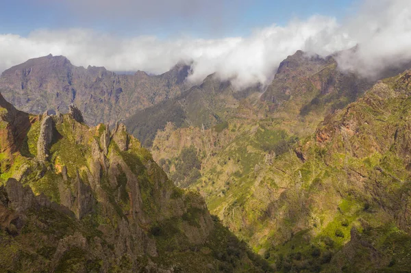 stock image Drone view of mountains buried in clouds during summer day