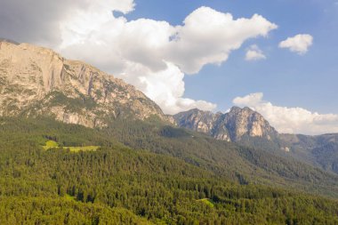 Drone photography of mountain forest and peaks during summer day