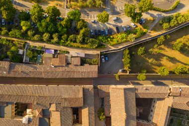 Drone view of old town alley in tuscany italy during summer day