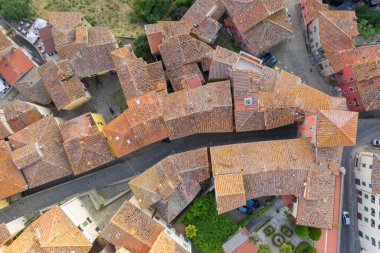 Drone view of old town alley in tuscany italy during summer day
