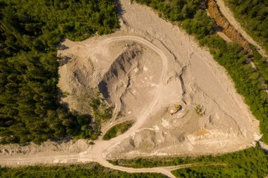 Drone photography of mountain quarry during summer day