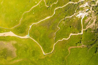 Drone photography of mountain river and march during summer day