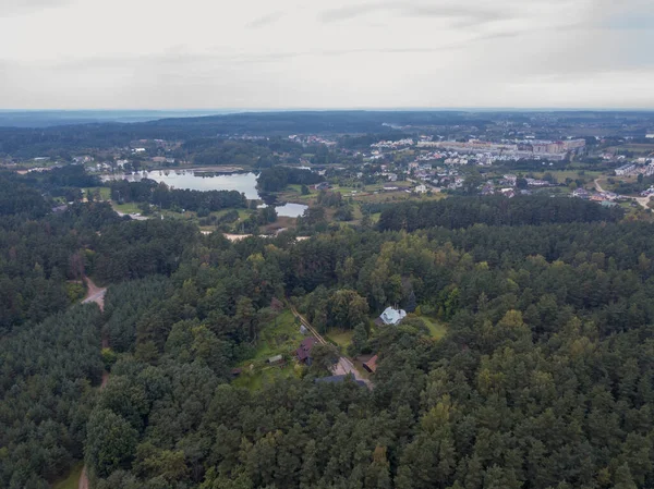 Drone photography of forest and city landscape during summer day