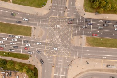 Drone photography of large intersection in a city during autumn day clipart