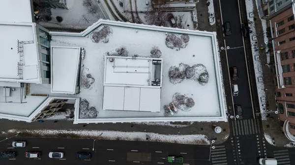 Drone point of view of a restaurant on a rooftop during winter day