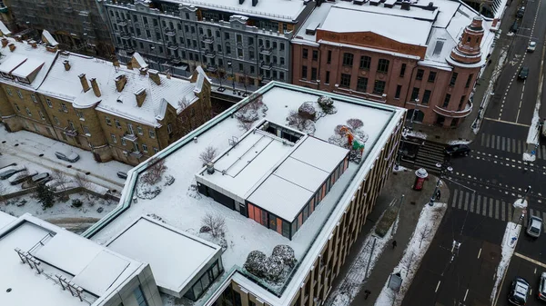 Drone point of view of a restaurant on a rooftop during winter day