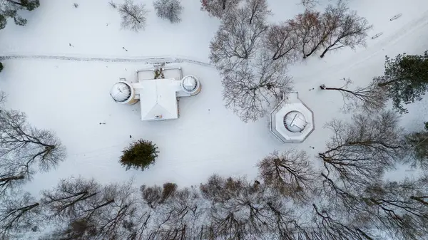 Drone photography of small observatory in a city park during winter day