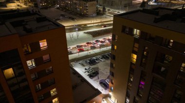 Drone photography of multistory houses in a city during winter night