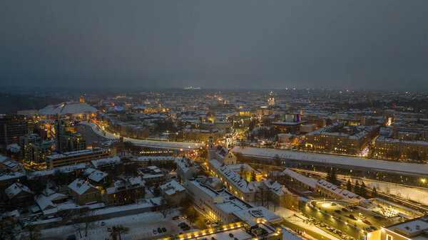 Drone photography of city old town and shinning lights during winter cloudy day