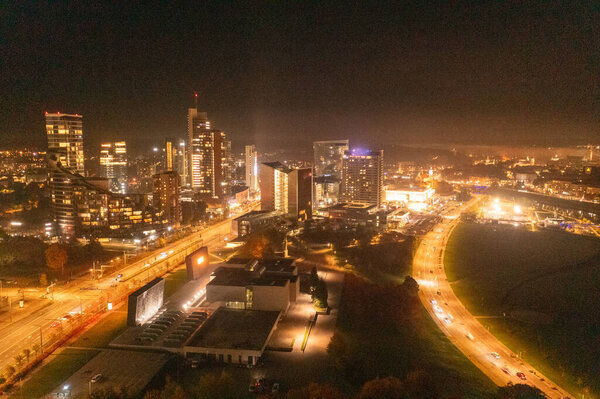 Drone photography of night city lights during autumn cloudless
