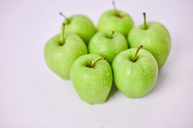 Apple ripe green apples on a white background, harvest fruits concept. Top view