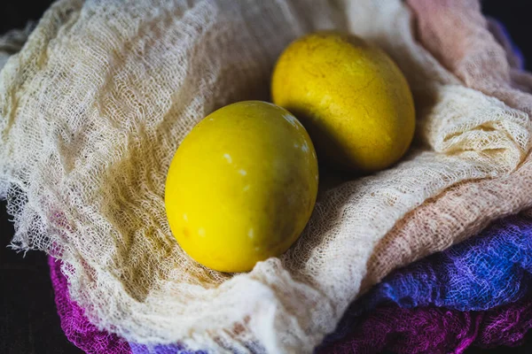 Easter. Natural dyed eggs and cheese cloths. Close up.