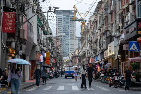 stock image Shanghai, China, June 05, 2024: Tourist pedestrian crowd walking at Nanjing road shopping street , which is the famous shopping district in Shanghai; 