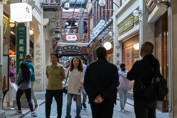 stock image Shanghai, June 06, 2024: Tourist visit to Yuyuan Bazaar in Shanghai. This is bustling energy of Shanghai's most famous commercial street, with a pedestrian mall surrounded by traditional and luxury shopping opportunities