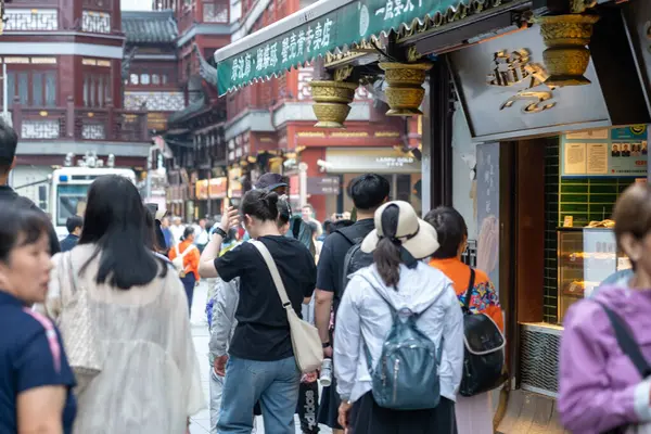 stock image Shanghai, June 06, 2024: Tourist visit to Yuyuan Bazaar in Shanghai. This is bustling energy of Shanghai's most famous commercial street, with a pedestrian mall surrounded by traditional and luxury shopping opportunities