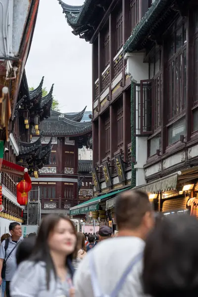 stock image Shanghai, June 06, 2024: Tourist visit to Yuyuan Bazaar in Shanghai. This is bustling energy of Shanghai's most famous commercial street, with a pedestrian mall surrounded by traditional and luxury shopping opportunities